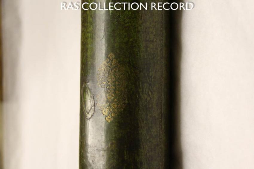 Cardboard tube telescope zoomed-in on gold decoration