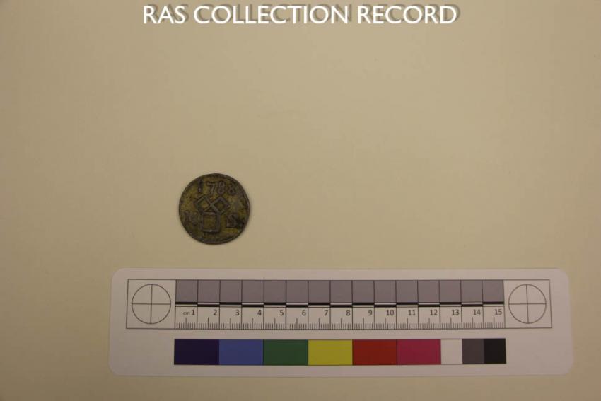 Silver token of the mathematical society on the side with the squares